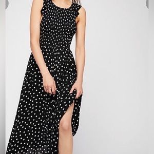 Free People S/P NWOT Black/White polka dot dress. Lined. Semi sheer fabric.